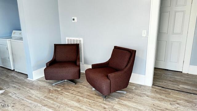 509 Cedar Creek Rd, Fayetteville, NC 28312 - living area featuring wood finished floors and washer and clothes dryer