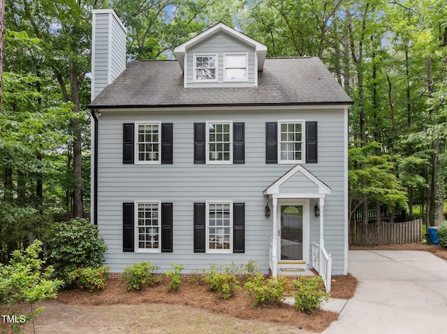 15 Gray Fox Ct, Durham, NC 27713 - view of front facade with a chimney and roof with shingles
