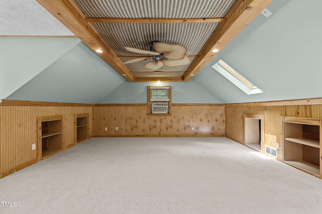 15 Gray Fox Ct, Durham, NC 27713 - additional living space featuring wood walls, a skylight, a ceiling fan, carpet flooring, and vaulted ceiling