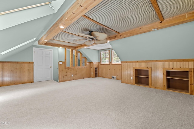 15 Gray Fox Ct, Durham, NC 27713 - bonus room featuring wood walls, vaulted ceiling, a ceiling fan, carpet, and a wainscoted wall