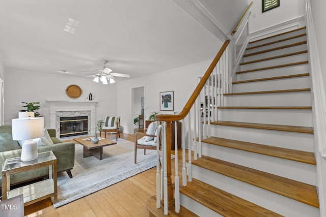 15 Gray Fox Ct, Durham, NC 27713 - living room featuring stairway, wood-type flooring, ceiling fan, a high end fireplace, and crown molding