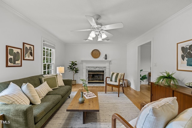15 Gray Fox Ct, Durham, NC 27713 - living area with crown molding, ceiling fan, a fireplace, and wood finished floors