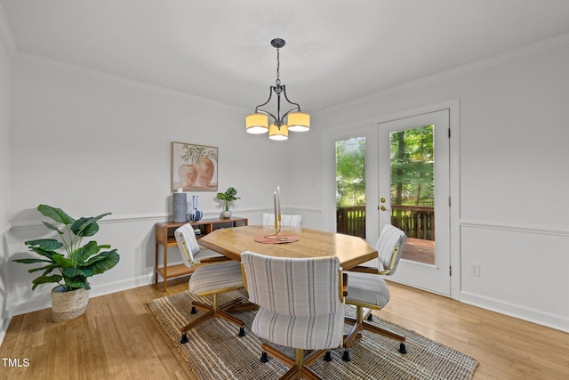15 Gray Fox Ct, Durham, NC 27713 - dining area featuring french doors, ornamental molding, light wood-style floors, a chandelier, and baseboards