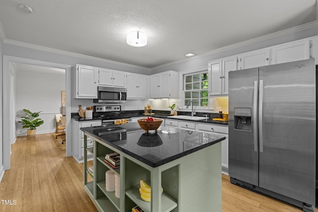 15 Gray Fox Ct, Durham, NC 27713 - kitchen featuring stainless steel appliances, a sink, open shelves, white cabinetry, and ornamental molding