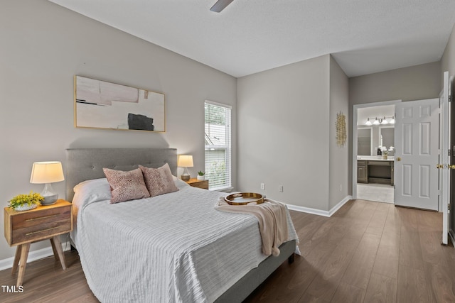 107 Covington Dr, Chapel Hill, NC 27514 - bedroom with wood finished floors, baseboards, connected bathroom, and ceiling fan