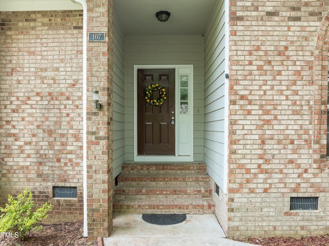 107 Covington Dr, Chapel Hill, NC 27514 - doorway to property with crawl space and brick siding