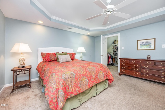 1230 Golden Bluff Ln, Fuquay Varina, NC 27526 - carpeted bedroom with crown molding, a raised ceiling, a walk in closet, a ceiling fan, and baseboards