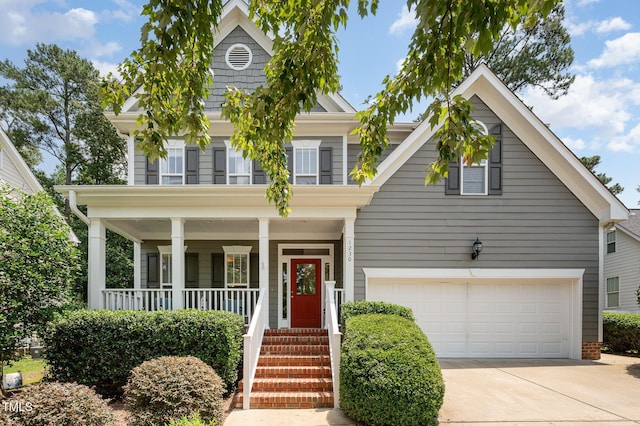 1230 Golden Bluff Ln, Fuquay Varina, NC 27526 - view of front of property featuring concrete driveway, covered porch, and a garage