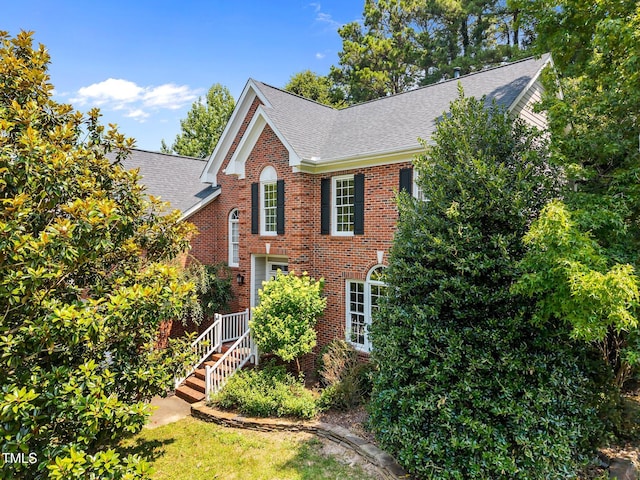 3306 Meadowrun Dr, Durham, NC 27707 - view of front of house with roof with shingles and brick siding