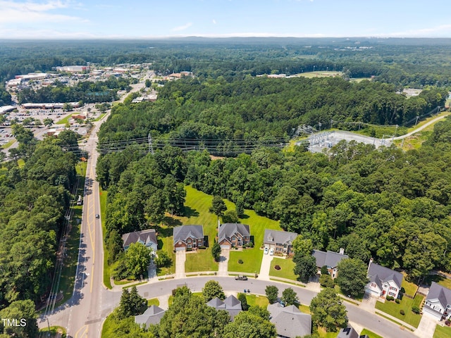 3306 Meadowrun Dr, Durham, NC 27707 - aerial view of property and surrounding area featuring a forest and nearby suburban area