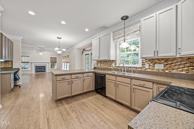 3306 Meadowrun Dr, Durham, NC 27707 - kitchen with black appliances, a peninsula, open floor plan, healthy amount of natural light, and ornamental molding