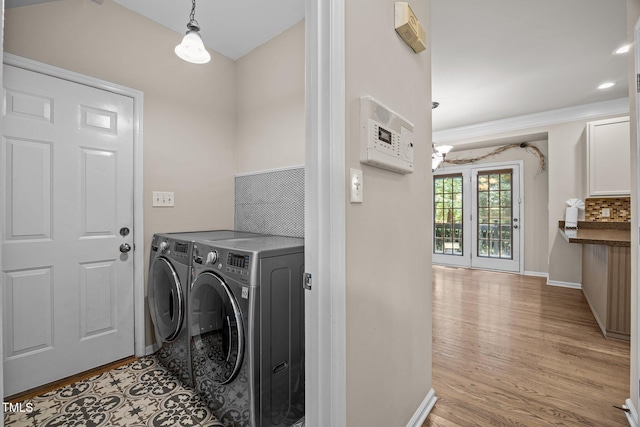 3306 Meadowrun Dr, Durham, NC 27707 - laundry area with washing machine and clothes dryer, a chandelier, and wood finished floors