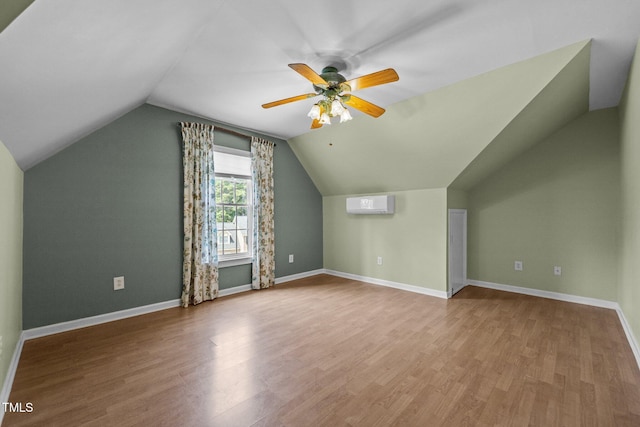 3306 Meadowrun Dr, Durham, NC 27707 - bonus room with vaulted ceiling, wood finished floors, a wall unit AC, and a ceiling fan