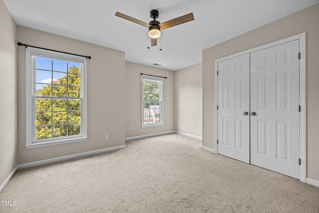 3306 Meadowrun Dr, Durham, NC 27707 - unfurnished bedroom featuring carpet, a closet, and a ceiling fan