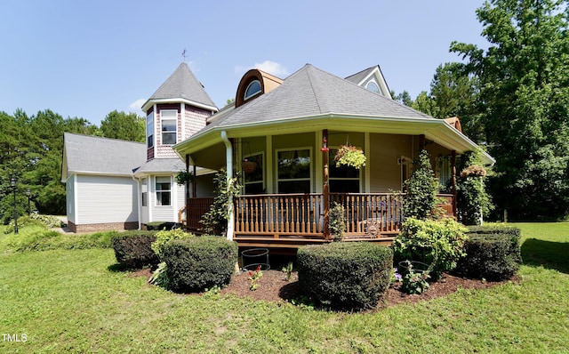 2816 Shepard School Rd, Zebulon, NC 27597 - victorian home with covered porch, a front yard, and a shingled roof