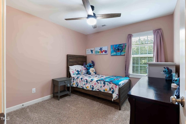 486 S Denise Ave, Coats, NC 27521 - carpeted bedroom with ceiling fan and baseboards