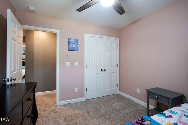 486 S Denise Ave, Coats, NC 27521 - bedroom with baseboards, a closet, carpet floors, and ceiling fan