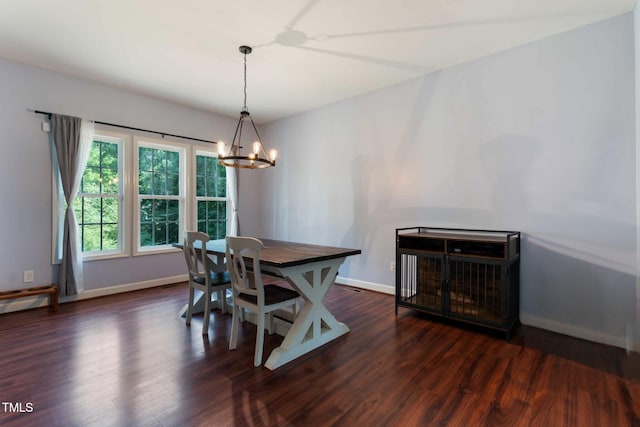 486 S Denise Ave, Coats, NC 27521 - dining room featuring a chandelier, dark wood-style floors, and baseboards