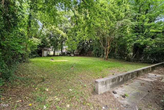 403 E Mulberry St, Goldsboro, NC 27530 - view of green lawn with a storage shed
