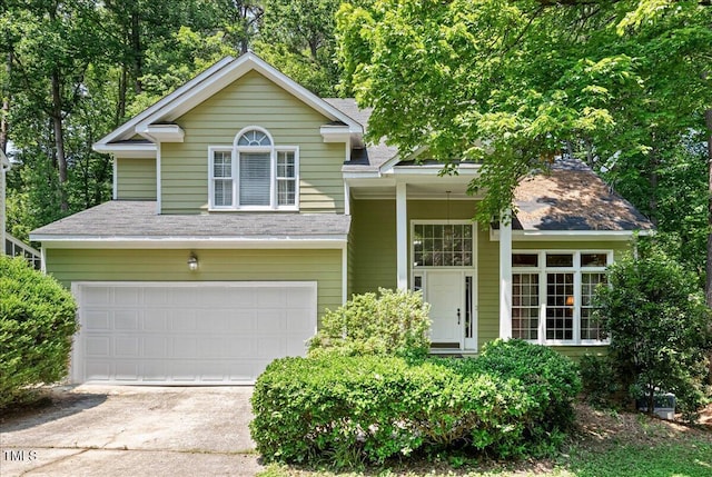 107 Canyon Run, Cary, NC 27513 - view of front of house with a garage, concrete driveway, and a shingled roof