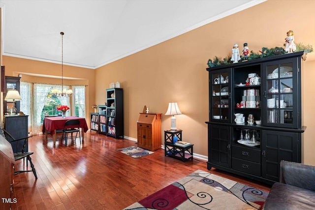 107 Canyon Run, Cary, NC 27513 - living area with a chandelier, wood finished floors, ornamental molding, and baseboards