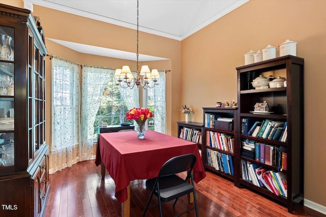 107 Canyon Run, Cary, NC 27513 - dining room with crown molding, a chandelier, and dark wood-type flooring