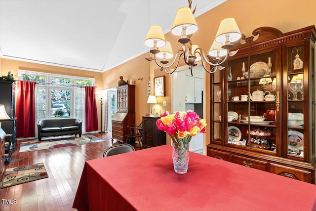 107 Canyon Run, Cary, NC 27513 - dining area with a chandelier, vaulted ceiling, and hardwood / wood-style floors