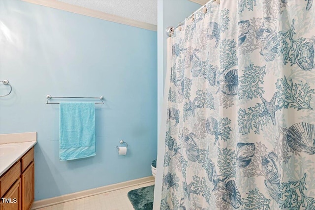 107 Canyon Run, Cary, NC 27513 - bathroom with vanity, toilet, a textured ceiling, a shower with curtain, and baseboards