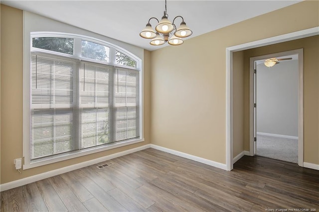 2298 Hackney Loop, Fayetteville, NC 28304 - unfurnished room featuring a chandelier, baseboards, and dark wood-style flooring