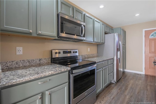2298 Hackney Loop, Fayetteville, NC 28304 - kitchen featuring appliances with stainless steel finishes, dark wood-style floors, recessed lighting, baseboards, and gray cabinets