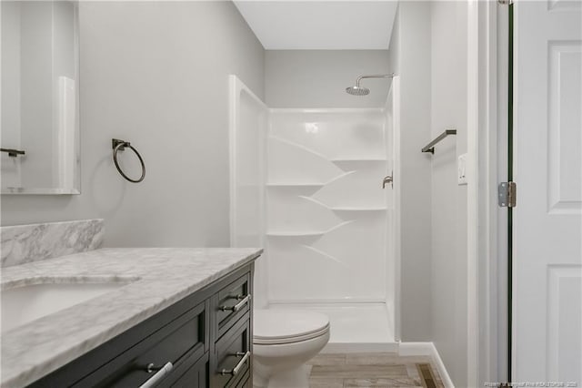 2298 Hackney Loop, Fayetteville, NC 28304 - bathroom with vanity, a shower, toilet, and wood finished floors