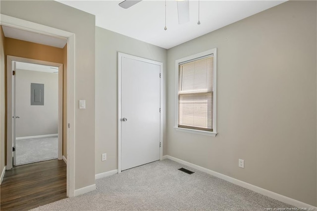 2298 Hackney Loop, Fayetteville, NC 28304 - unfurnished bedroom with baseboards, carpet floors, and a closet