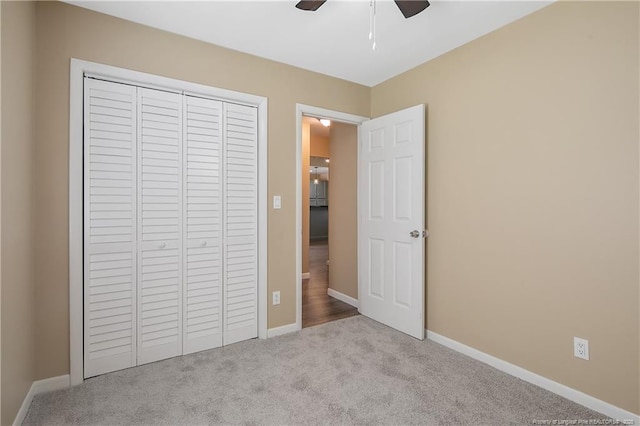 2298 Hackney Loop, Fayetteville, NC 28304 - unfurnished bedroom with carpet, a closet, baseboards, and a ceiling fan