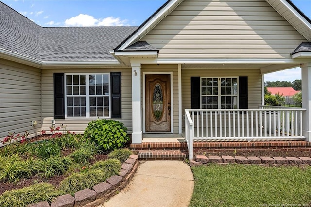 107 Hayes Ct, Raeford, NC 28376 - view of exterior entry with covered porch and a shingled roof