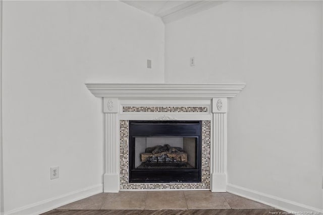 107 Hayes Ct, Raeford, NC 28376 - detailed view of baseboards and a tiled fireplace