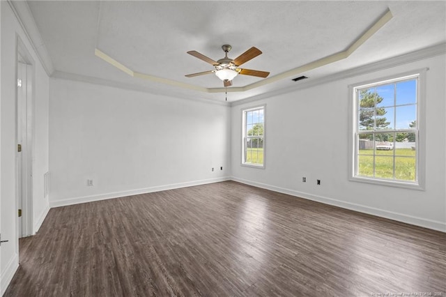 107 Hayes Ct, Raeford, NC 28376 - unfurnished room with a tray ceiling, dark wood-type flooring, a ceiling fan, baseboards, and ornamental molding