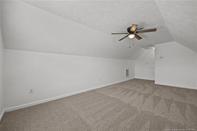 107 Hayes Ct, Raeford, NC 28376 - bonus room with lofted ceiling, ceiling fan, carpet flooring, baseboards, and a textured ceiling