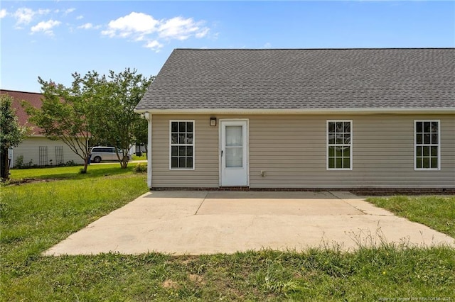 107 Hayes Ct, Raeford, NC 28376 - back of property featuring a patio and a lawn