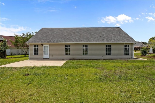 107 Hayes Ct, Raeford, NC 28376 - back of house featuring a patio and a lawn
