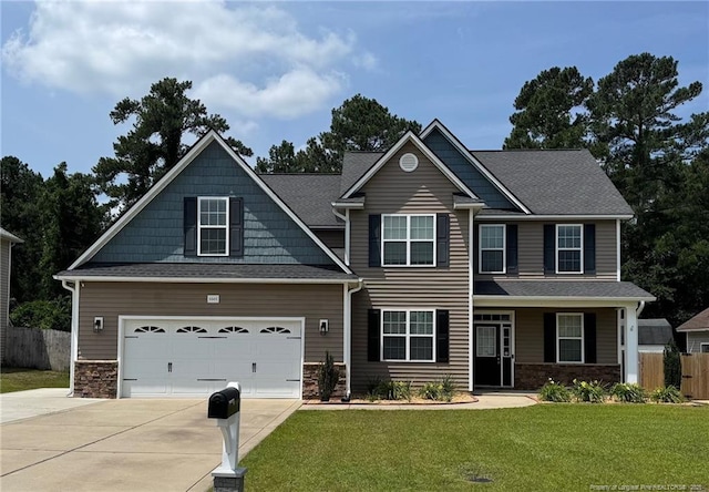 1545 Gallant Fox Ct, Parkton, NC 28371 - craftsman house with concrete driveway, stone siding, and a garage