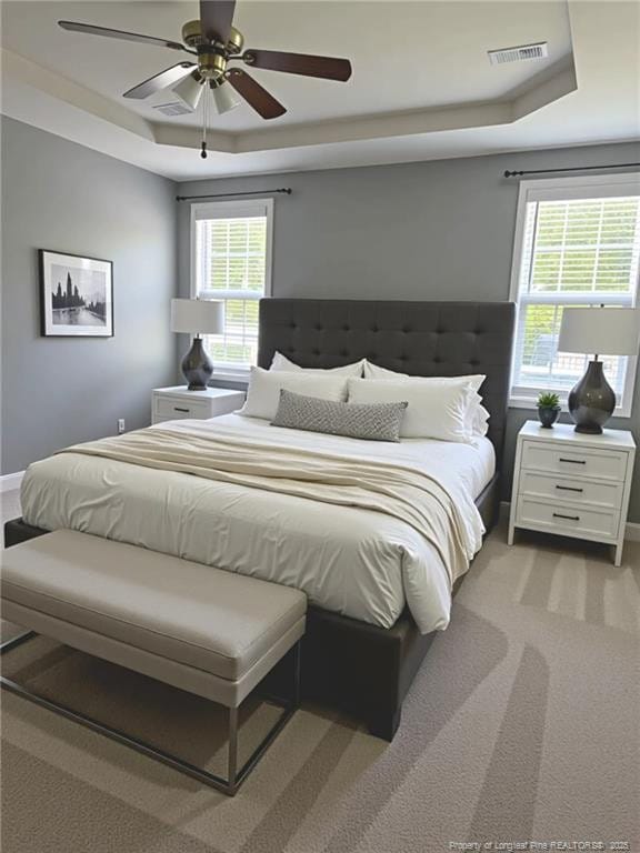 1545 Gallant Fox Ct, Parkton, NC 28371 - bedroom featuring a raised ceiling, carpet floors, a ceiling fan, and baseboards