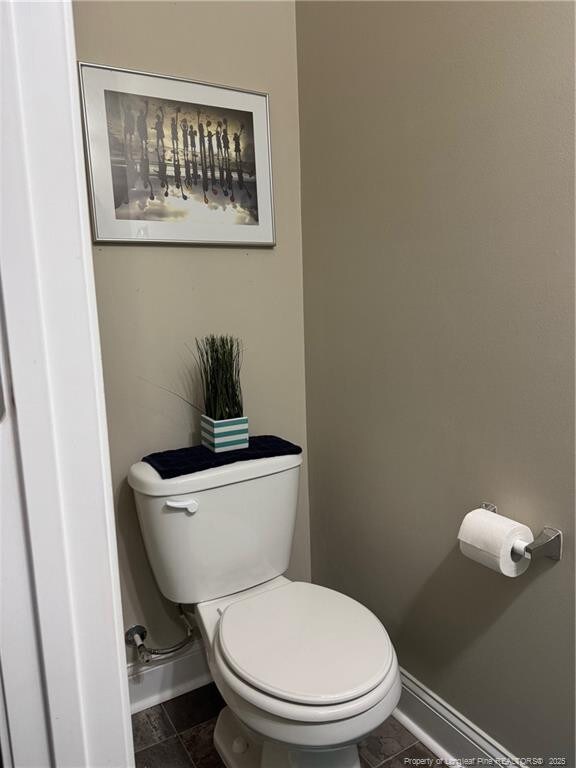 1545 Gallant Fox Ct, Parkton, NC 28371 - bathroom featuring baseboards and toilet
