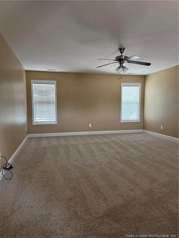 1545 Gallant Fox Ct, Parkton, NC 28371 - carpeted spare room featuring baseboards and a ceiling fan
