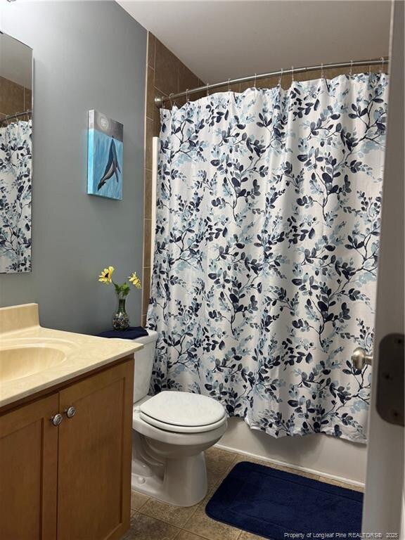 1545 Gallant Fox Ct, Parkton, NC 28371 - bathroom featuring vanity, toilet, and tile patterned floors