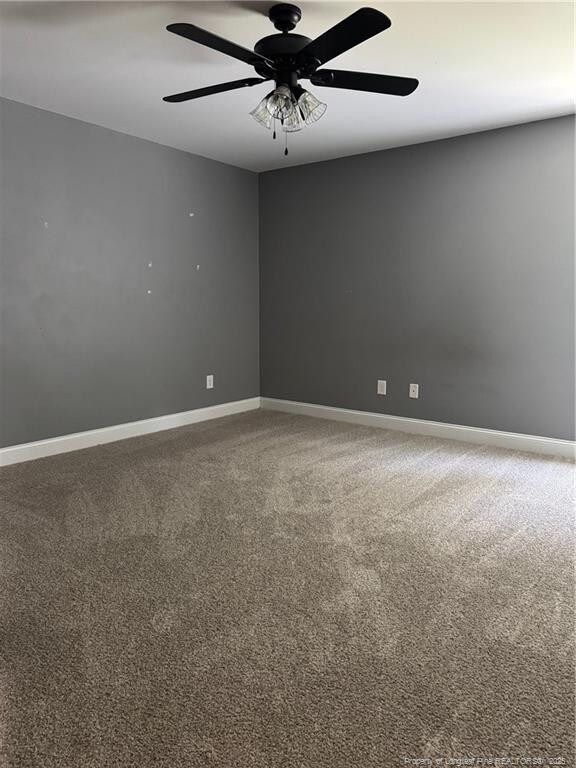1545 Gallant Fox Ct, Parkton, NC 28371 - empty room featuring ceiling fan, carpet flooring, and baseboards