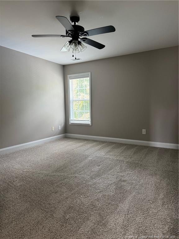 1545 Gallant Fox Ct, Parkton, NC 28371 - empty room featuring baseboards, carpet, and a ceiling fan