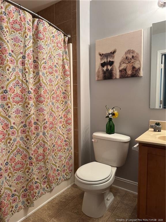 1545 Gallant Fox Ct, Parkton, NC 28371 - bathroom featuring vanity, tile patterned flooring, toilet, a shower with curtain, and baseboards