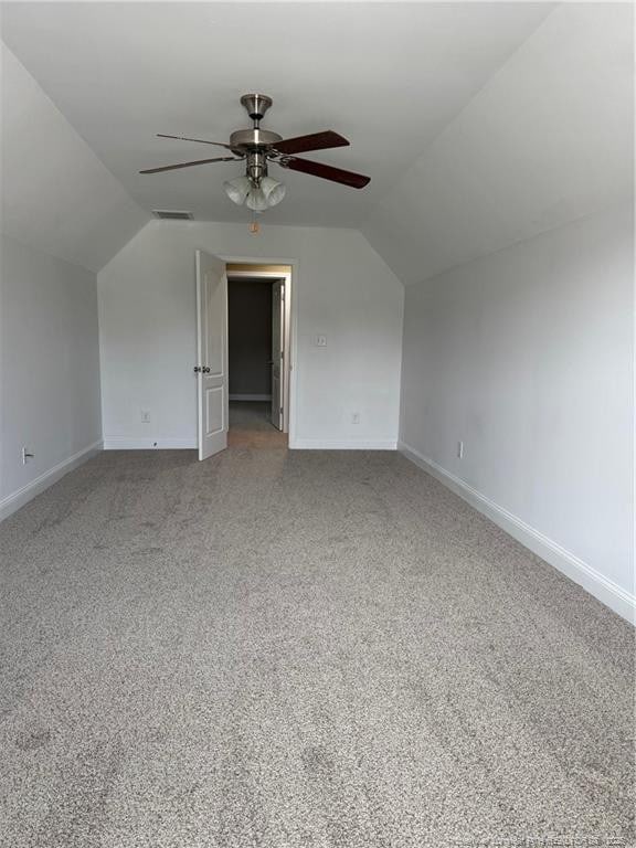 1545 Gallant Fox Ct, Parkton, NC 28371 - additional living space featuring vaulted ceiling, ceiling fan, baseboards, and carpet floors