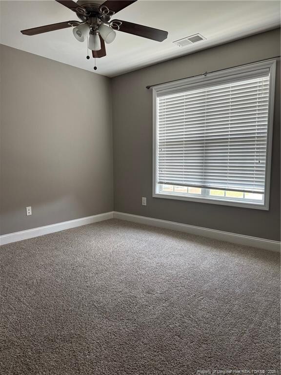 1545 Gallant Fox Ct, Parkton, NC 28371 - carpeted spare room with a ceiling fan and baseboards