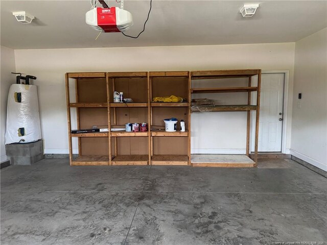 1545 Gallant Fox Ct, Parkton, NC 28371 - garage with a garage door opener, water heater, and baseboards